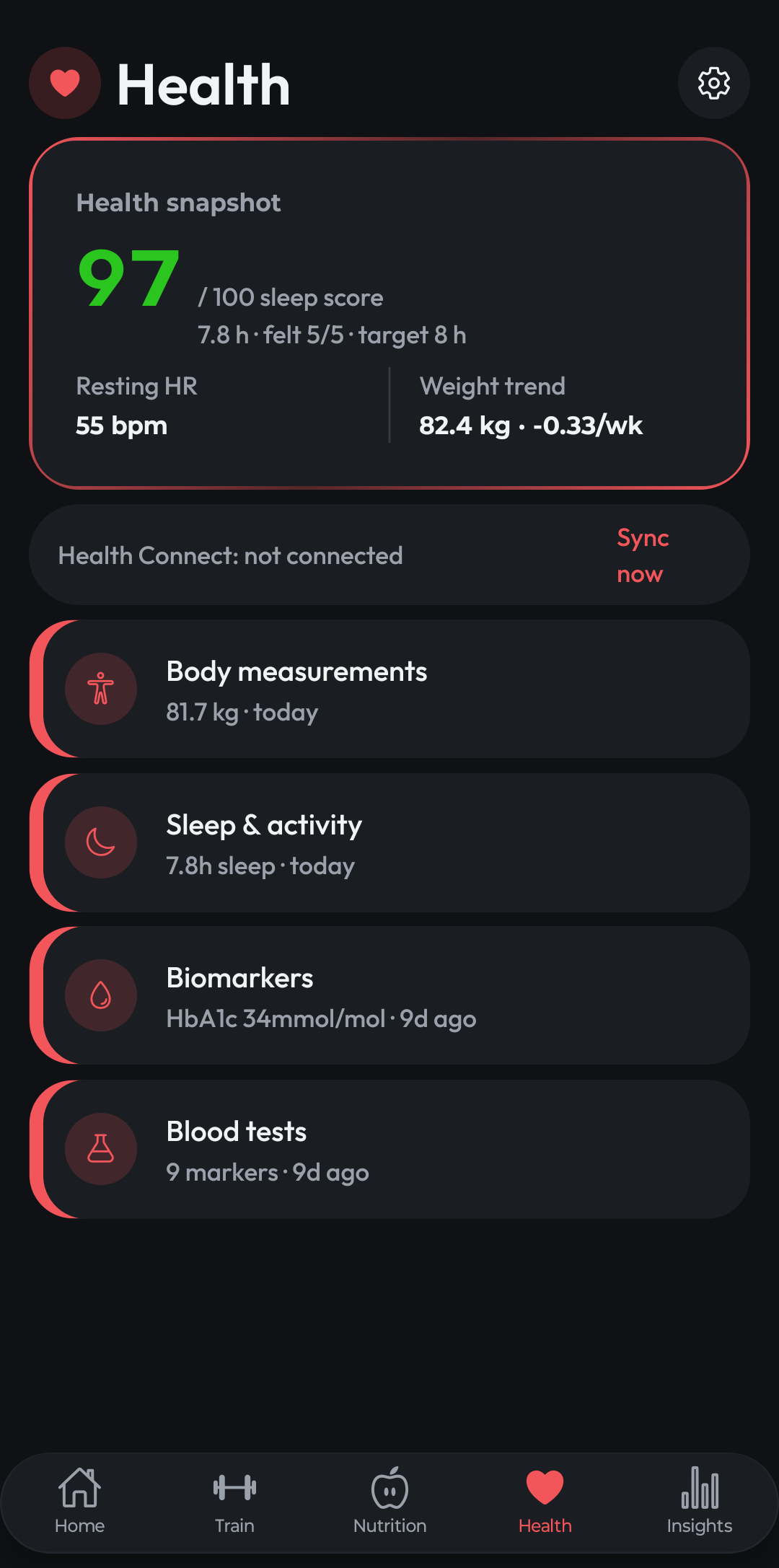 ComniWell Health tab showing the health snapshot with sleep score, resting heart rate and weight trend, plus body measurements, biomarkers and blood tests